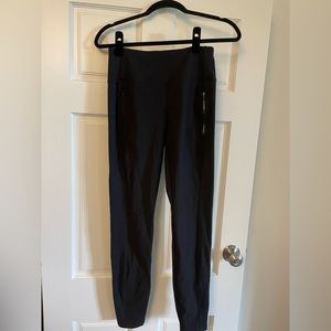Athleta size small black leggings with zipper pockets and zipper detail at ankle